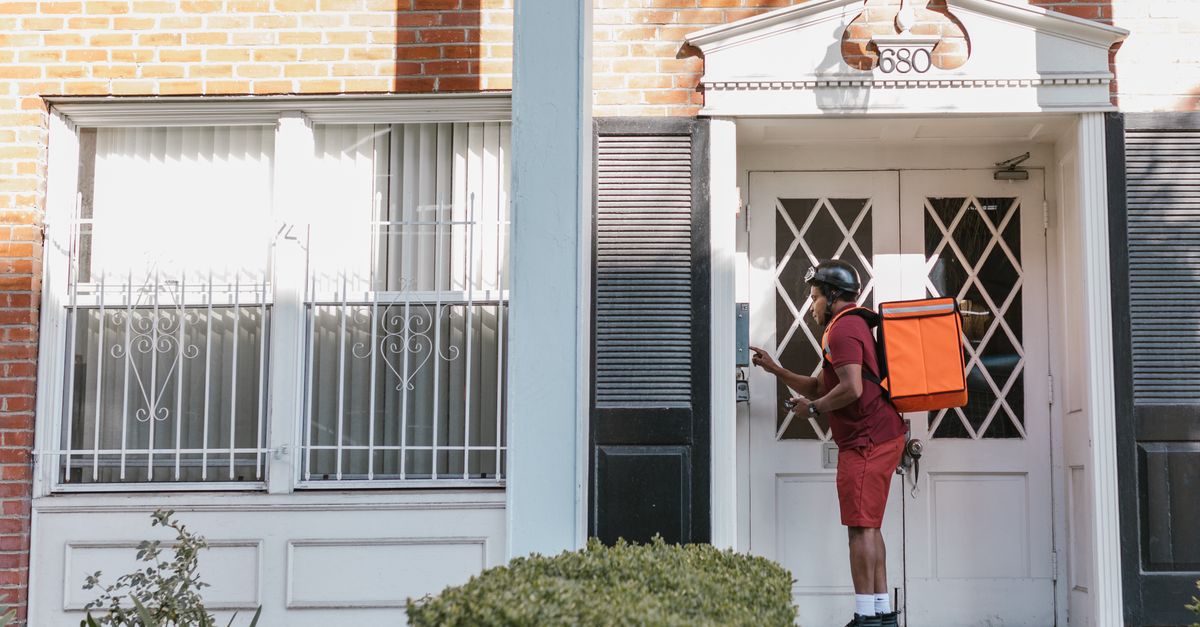 locksmith unlocking front door — West Orange Locksmith Corp